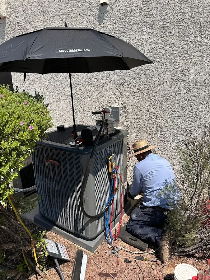 HVAC technician performing outdoor AC maintenance in Sodus